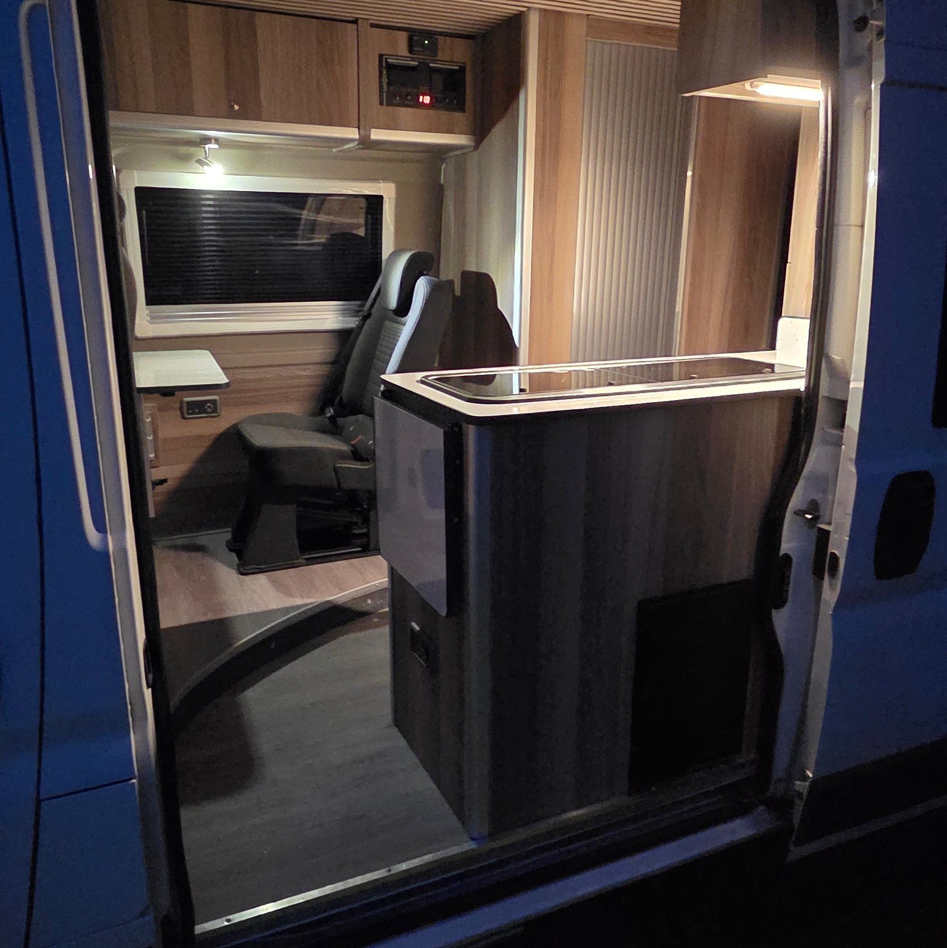 Lit up at dusk with the side door open.